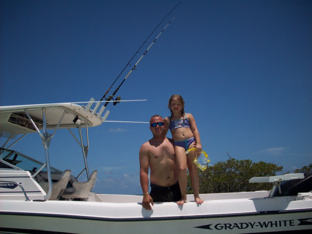 Maddie with Big Brother "Chris" on his 26' Grady White with a 225 Mercury